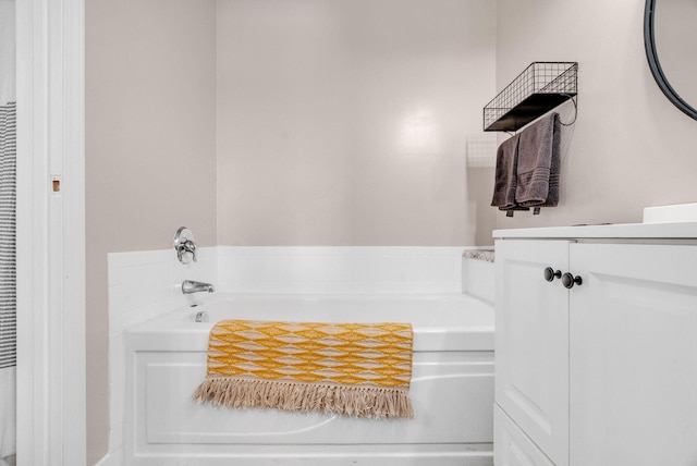 bathroom featuring a tub and vanity