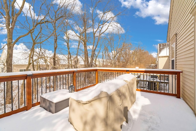 view of snow covered deck