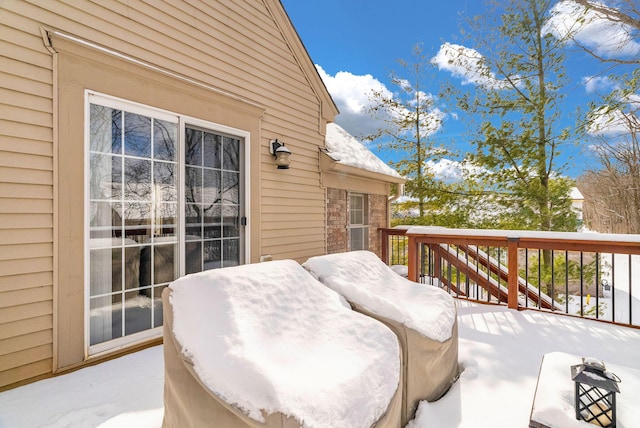 view of snow covered deck