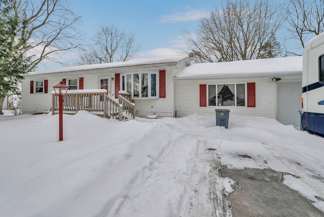 single story home featuring an attached garage