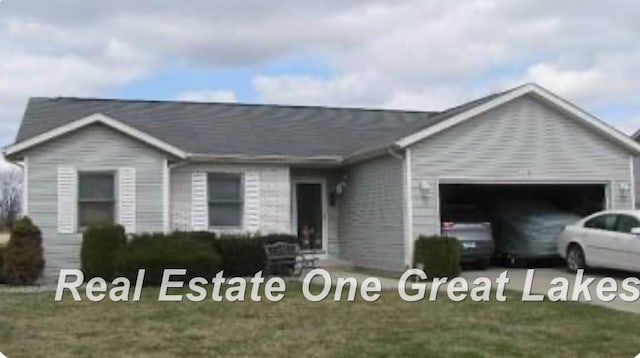 view of front of house featuring a garage and a front yard