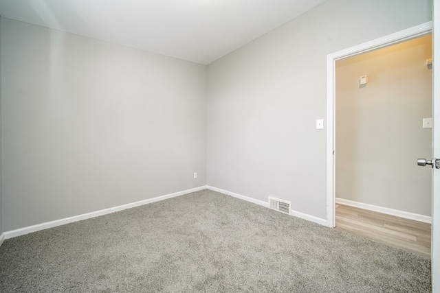 unfurnished room with carpet flooring