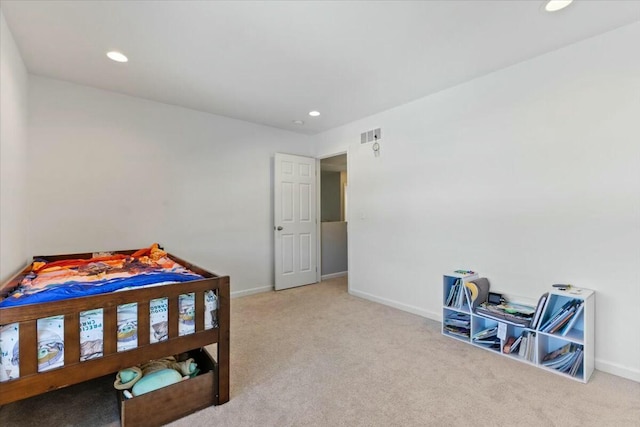 bedroom featuring light colored carpet