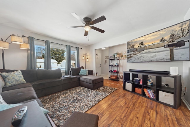 living room featuring ceiling fan and wood-type flooring