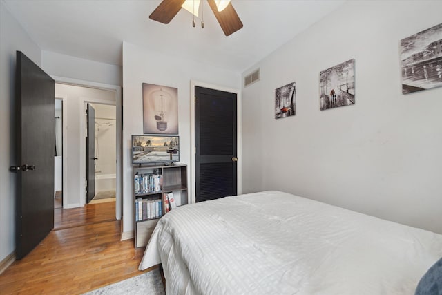 bedroom featuring ceiling fan and wood-type flooring