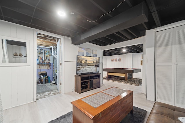 living room featuring hardwood / wood-style floors and billiards