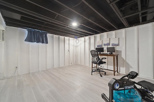 basement featuring hardwood / wood-style floors