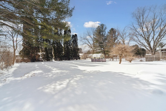 view of yard layered in snow