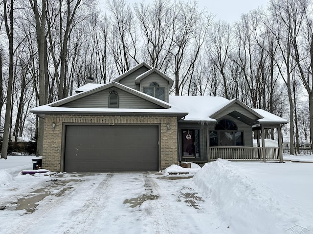 view of front of property featuring a garage and a porch