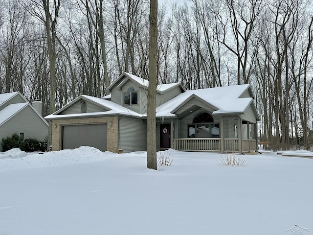 view of front facade with covered porch and a garage