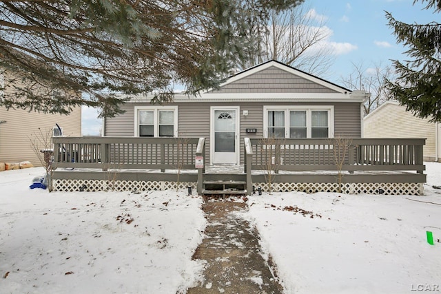 bungalow-style house with a deck