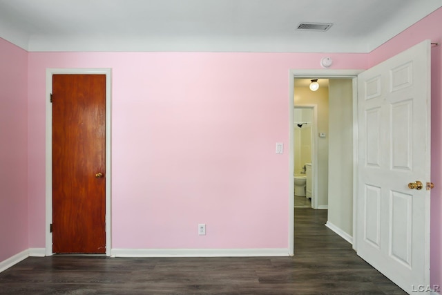 unfurnished room with dark hardwood / wood-style floors