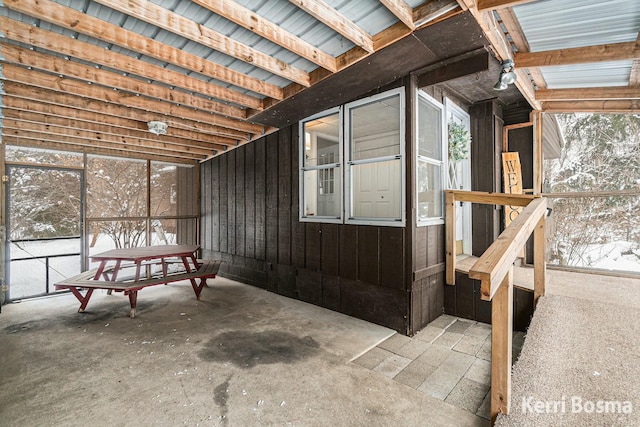 miscellaneous room with unfinished concrete floors