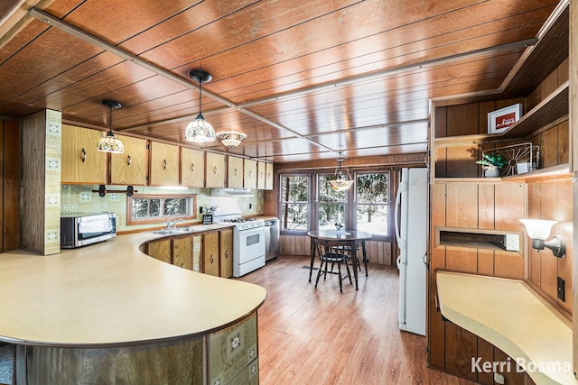 kitchen with light countertops, hanging light fixtures, wood ceiling, a sink, and white appliances