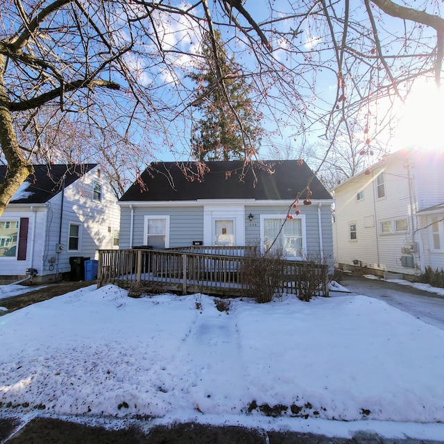 bungalow-style house with a wooden deck