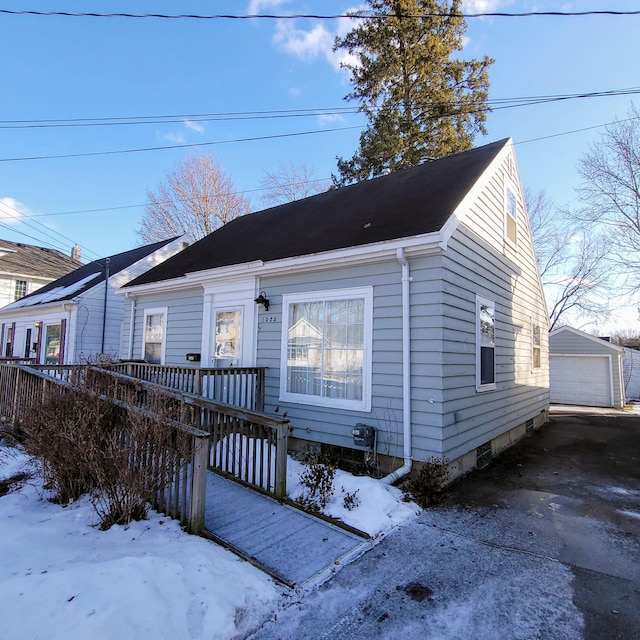 view of front of home with an outbuilding and a garage