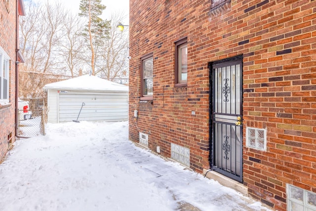 view of snow covered property entrance