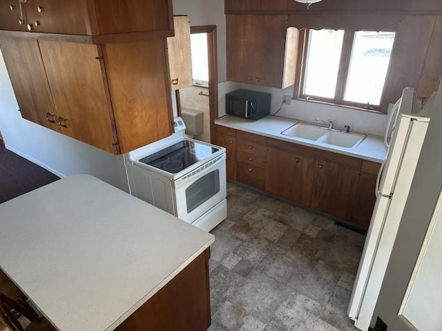 kitchen with white appliances and sink