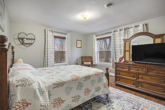 bedroom featuring dark hardwood / wood-style floors