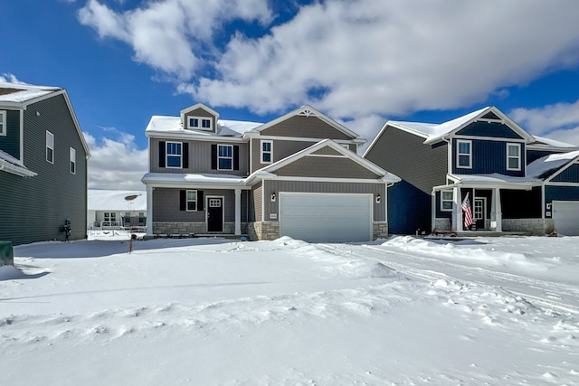 view of front of home featuring an attached garage and stone siding