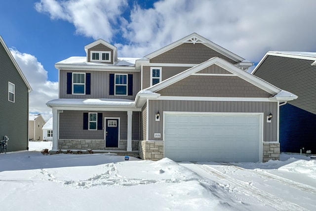 craftsman inspired home with an attached garage, stone siding, and board and batten siding