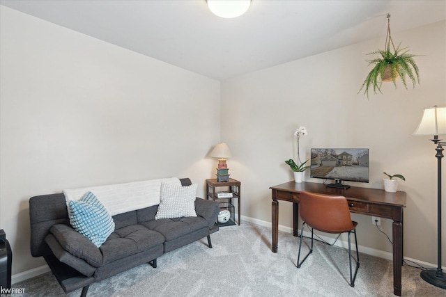 home office featuring light colored carpet and baseboards