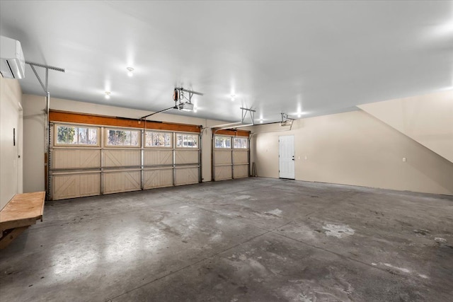 garage featuring an AC wall unit and a garage door opener