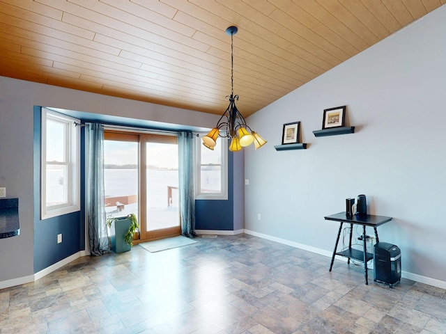 unfurnished dining area featuring baseboards, stone finish floor, an inviting chandelier, wooden ceiling, and lofted ceiling