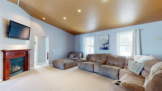 living room featuring light colored carpet, a glass covered fireplace, baseboards, wooden ceiling, and lofted ceiling