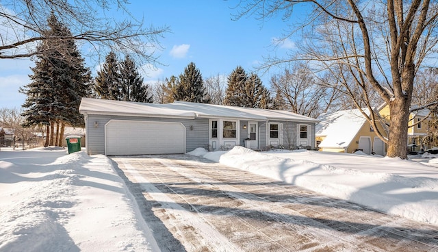 view of front of property with a garage and driveway