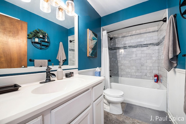 bathroom with toilet, vanity, and shower / bath combo with shower curtain