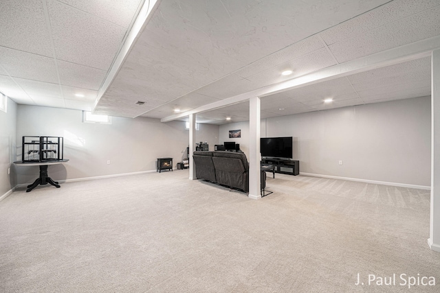 basement with baseboards and carpet flooring