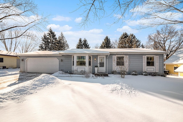 view of front of property featuring driveway and an attached garage