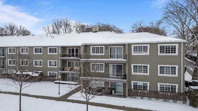 view of snow covered property