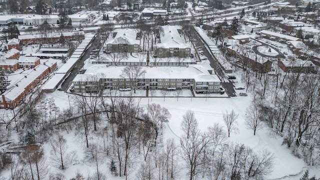 snowy aerial view featuring a residential view