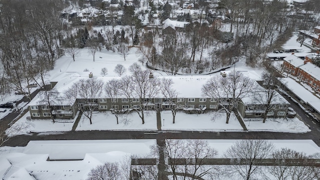 snowy aerial view with a residential view