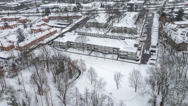 snowy aerial view featuring a residential view