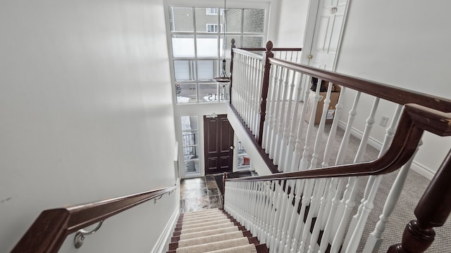 stairway featuring baseboards