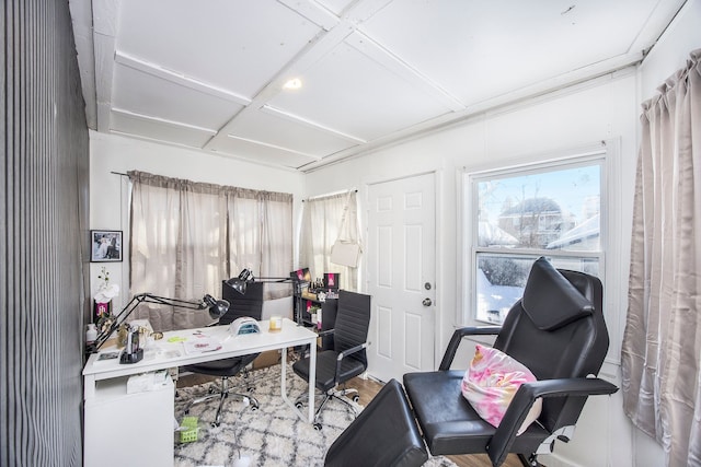 home office with coffered ceiling and wood finished floors