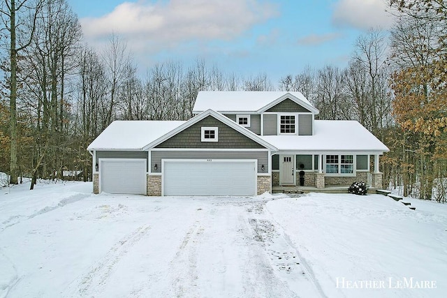 view of front of property with a porch and a garage