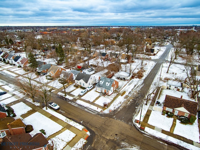 snowy aerial view with a residential view