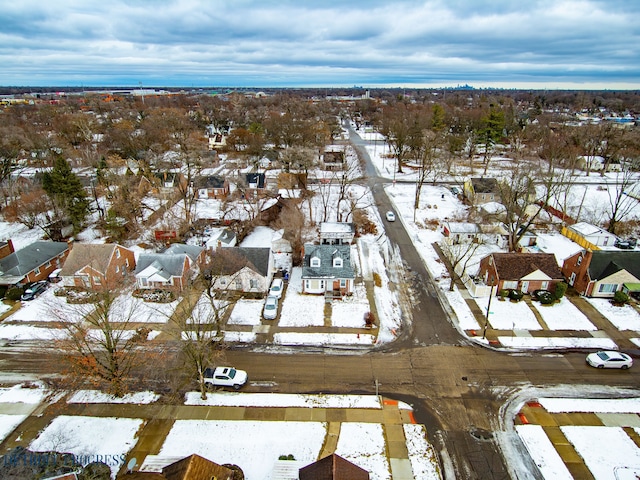 snowy aerial view featuring a residential view