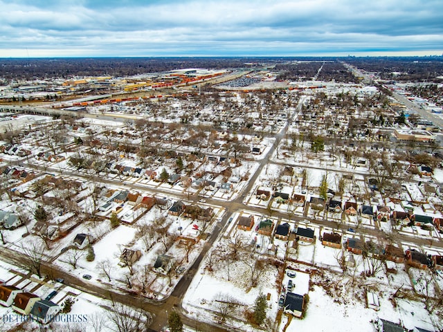 snowy aerial view with a residential view