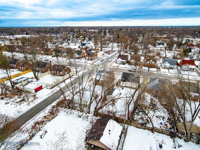 snowy aerial view featuring a residential view