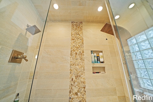 full bath with recessed lighting and a tile shower