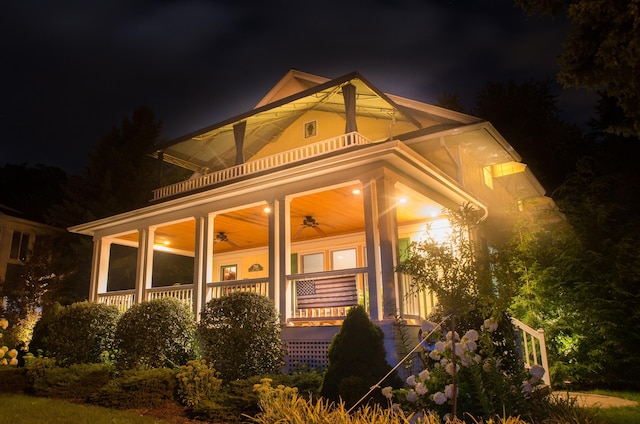 exterior space with a porch and a ceiling fan