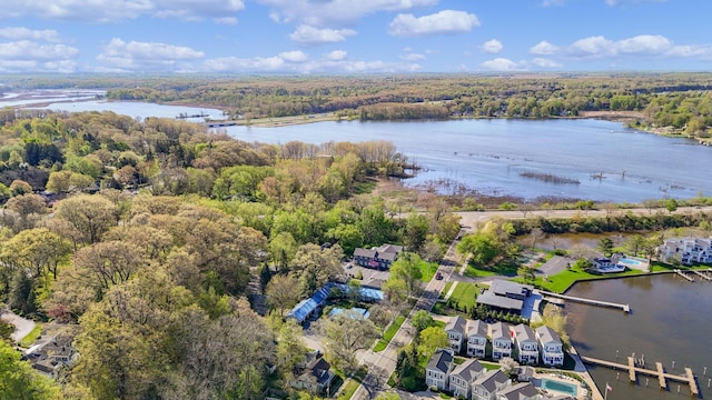 aerial view with a forest view and a water view