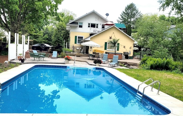 view of swimming pool featuring fence, a fenced in pool, and a patio area