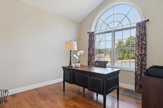 home office with vaulted ceiling, baseboards, and hardwood / wood-style floors