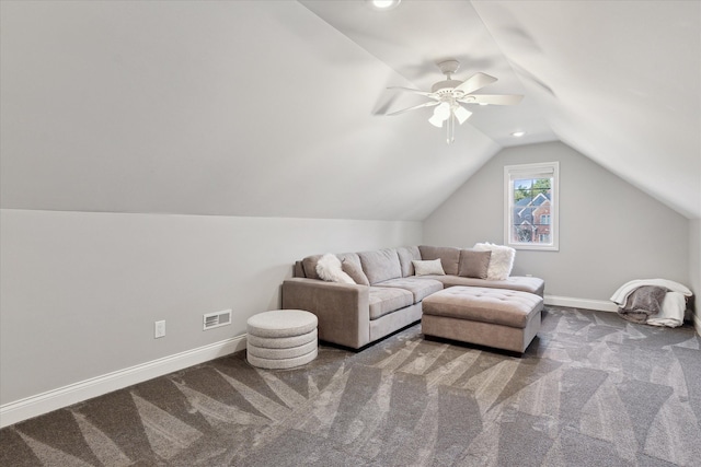 carpeted living area featuring visible vents, baseboards, lofted ceiling, and a ceiling fan